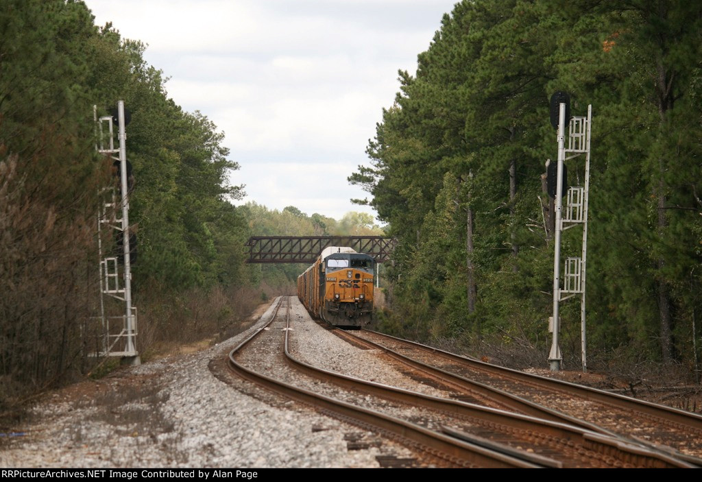 CSX 5416 waits for green with a line of autoracks